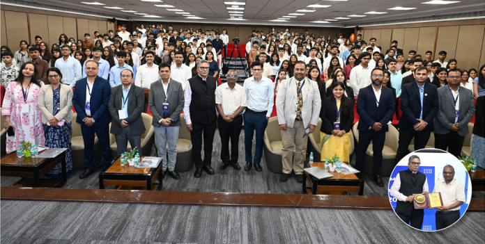 Dr. Anshuman Jaswal, Dr. Rajeev Srivastava and distinguished guests welcome the new BBA and B.Com students during the induction program at NMIMS Indore.
