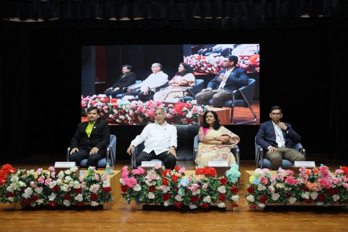 Shri Rajgopal Bhandari, Dr. Venkatadri M and Dr. Sunita Patil with first-year students during the inauguration of the Induction Program 2026–27 at NMIMS MPSTME Shirpur.
